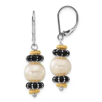 A pair of drop earrings with lever-back closures featuring cream-colored pearl spheres separated by black enameled spacers with rhinestone accents and gold-tone textured caps.