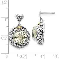 A pair of silver drop earrings with heart-shaped tops, featuring round pale yellow stones surrounded by ornate beaded frames and gold accents, shown against a measurement scale.