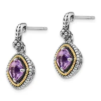 Pair of silver drop earrings with gold-tone twisted bezels surrounding oval amethyst stones, featuring decorative lion head details at the top and textured silver posts.