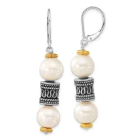 A pair of silver lever-back earrings with cream pearls, gold-tone spacer beads, and decorative silver cylindrical elements with patterned details.