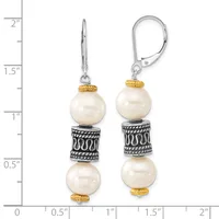 Pair of dangling earrings with cream pearls separated by ornate silver spacer bands with gold-tone caps, shown against a ruler measuring approximately two inches in length.
