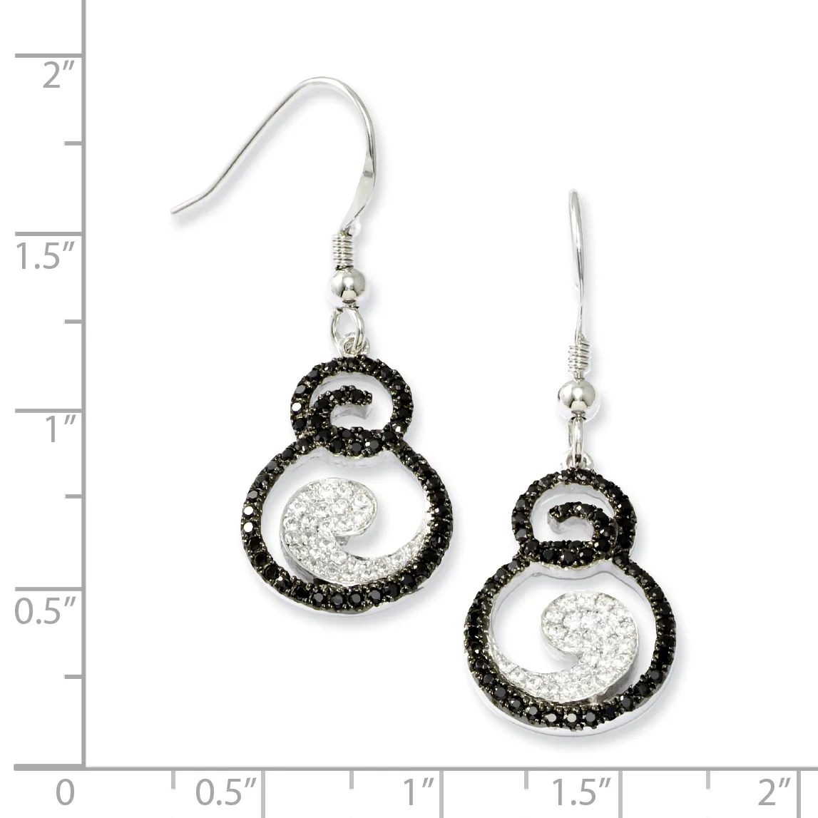 A pair of silver dangle earrings with black crystal-studded circular frames enclosing white crystal-filled spiral designs, displayed against a measurement scale.