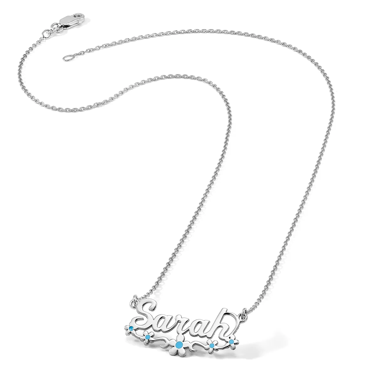 Silver chain necklace with a pendant spelling out a name in cursive script, decorated with small turquoise stones.