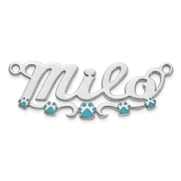 Silver-toned pendant with cursive "mule" lettering and turquoise paw print charms hanging from loops at each end.