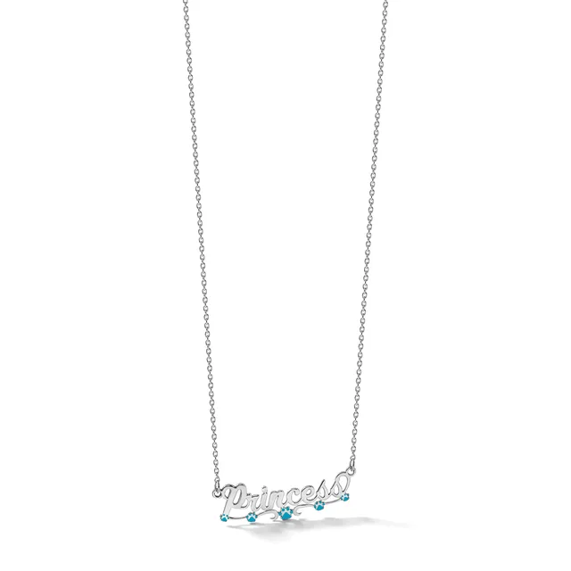 Silver necklace with a pendant spelling out a name in script, decorated with small turquoise stones, hanging from a delicate chain.