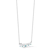Silver necklace with a pendant spelling out a name in script, decorated with small turquoise stones, hanging from a delicate chain.