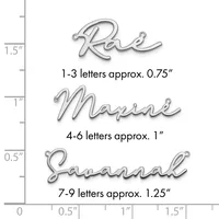 Three examples of script letter pendants shown against a ruler, ranging from approximately 0.75 inches to 1.25 inches in height, displayed with small loops at the top for hanging.