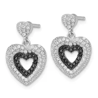 A pair of silver heart-shaped dangle earrings with white and black cubic zirconia stones, featuring a smaller heart stud with a larger heart pendant below.