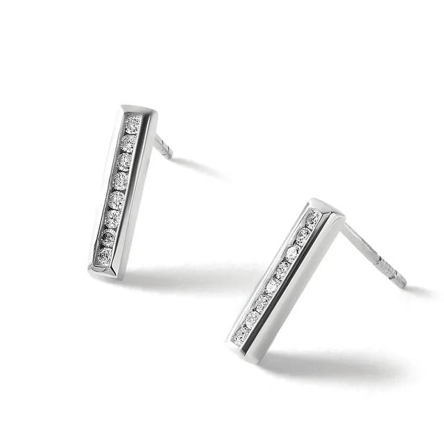 A pair of silver rectangular bar earrings set with small round diamonds in a channel setting, shown at angles against a white background.