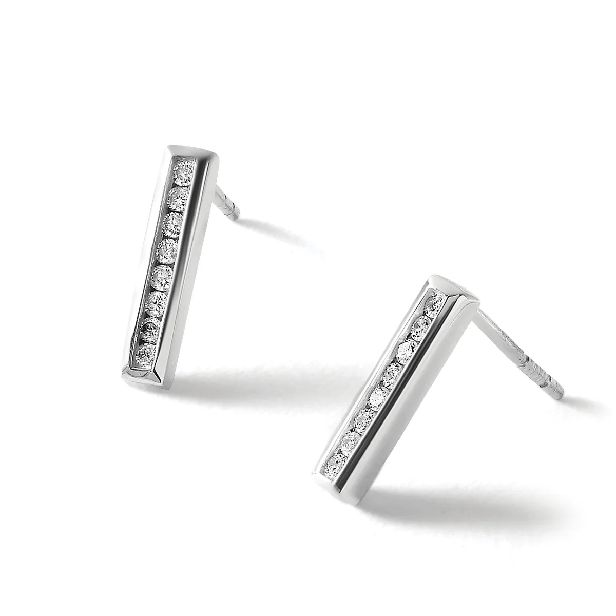 A pair of silver rectangular bar earrings set with small round diamonds in a channel setting, shown at angles against a white background.