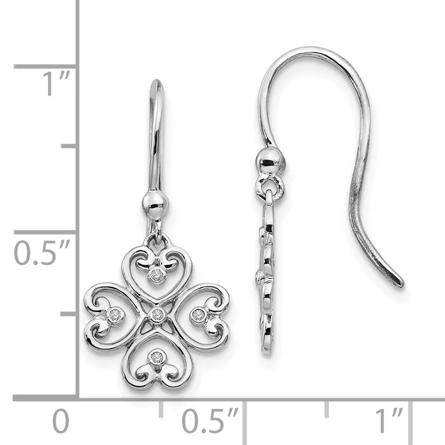 A pair of silver four-lobed clover earrings with diamond accents and curved wire hooks, displayed against a measurement scale showing approximately one inch in length.