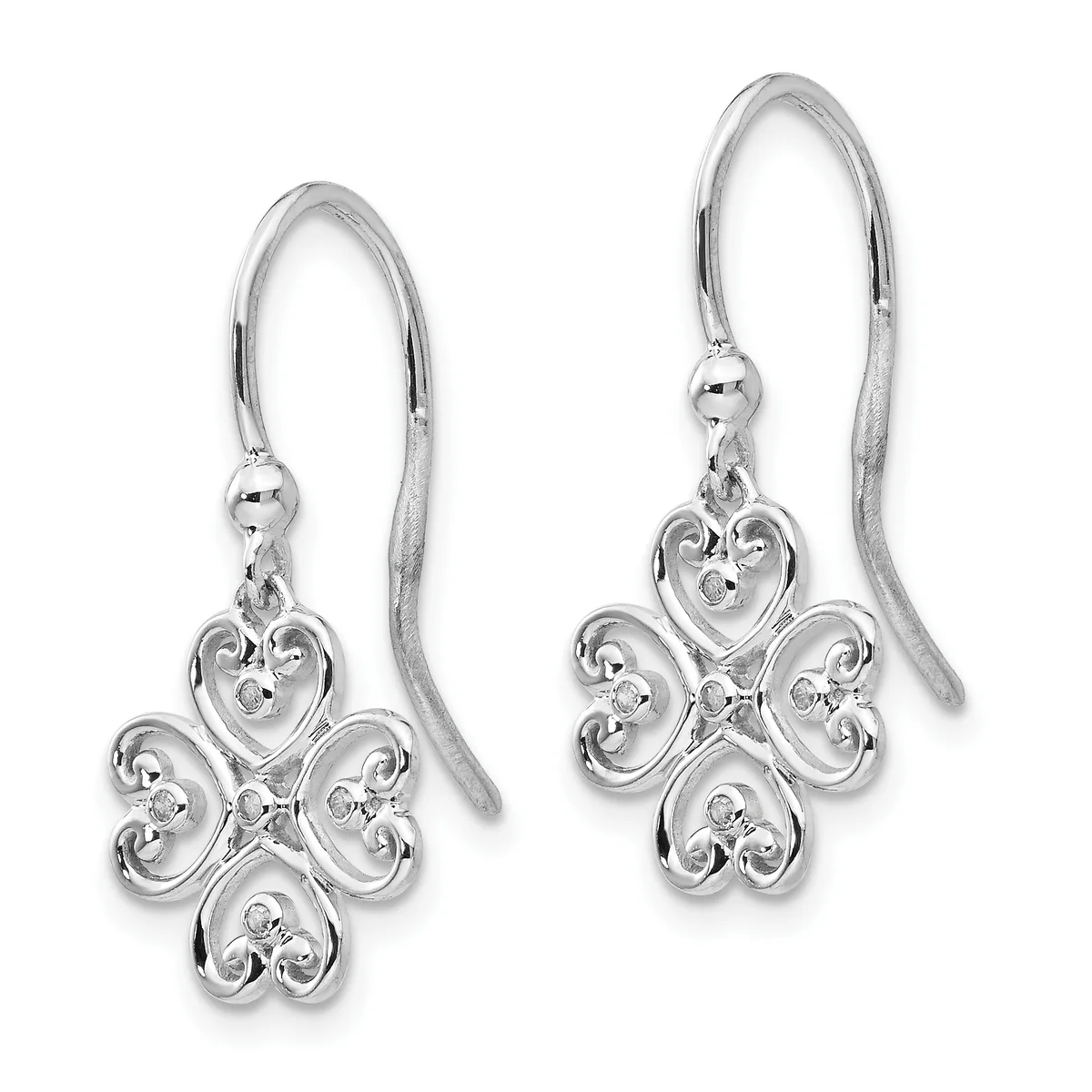 A pair of silver drop earrings with ornate four-lobed heart-shaped pendants featuring decorative scrollwork and small gemstones, suspended from curved wire hooks.