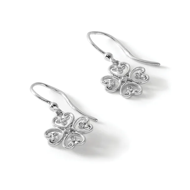 A pair of silver drop earrings with ornate four-lobed clover-shaped pendants featuring small diamond accents, suspended from curved wire hooks.