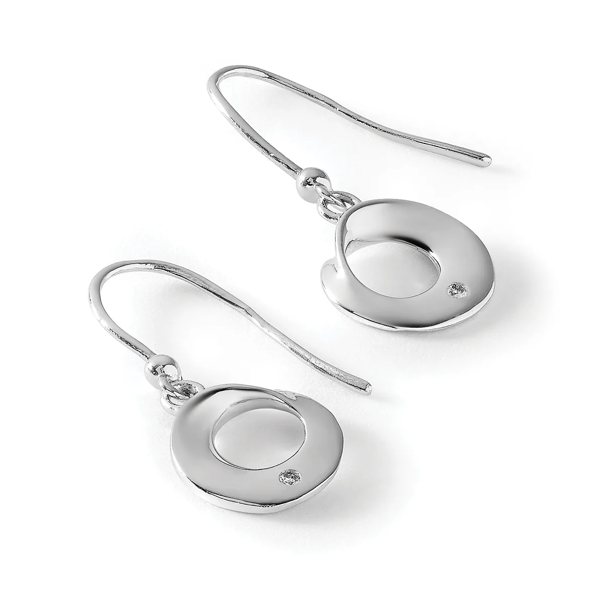 A pair of silver-toned drop earrings with circular disc pendants featuring small diamond accents, suspended from curved wire hooks.