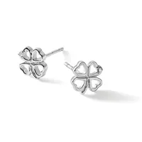 A pair of silver four-leaf clover stud earrings with hollow heart-shaped petals and small diamond accents, shown from two angles on a white background.