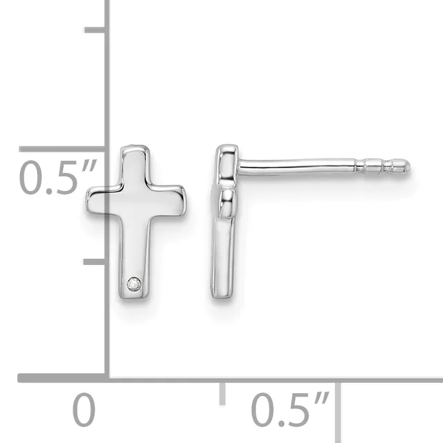 A pair of silver cross-shaped stud earrings with a small diamond accent, shown front and side views on a measurement scale indicating 0.5 inches in height.