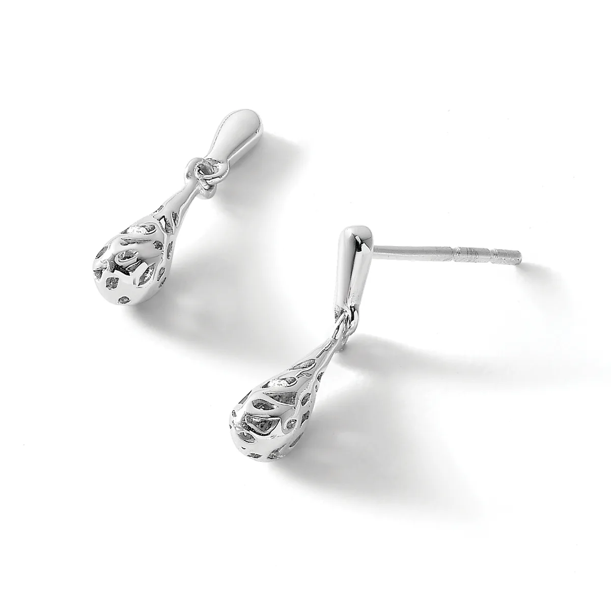 A pair of silver teardrop earrings with ornate filigree detailing and stud posts, displayed against a white background.