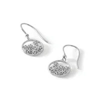 A pair of silver drop earrings with oval filigree pendants featuring decorative cutout patterns, suspended from curved ear wires.