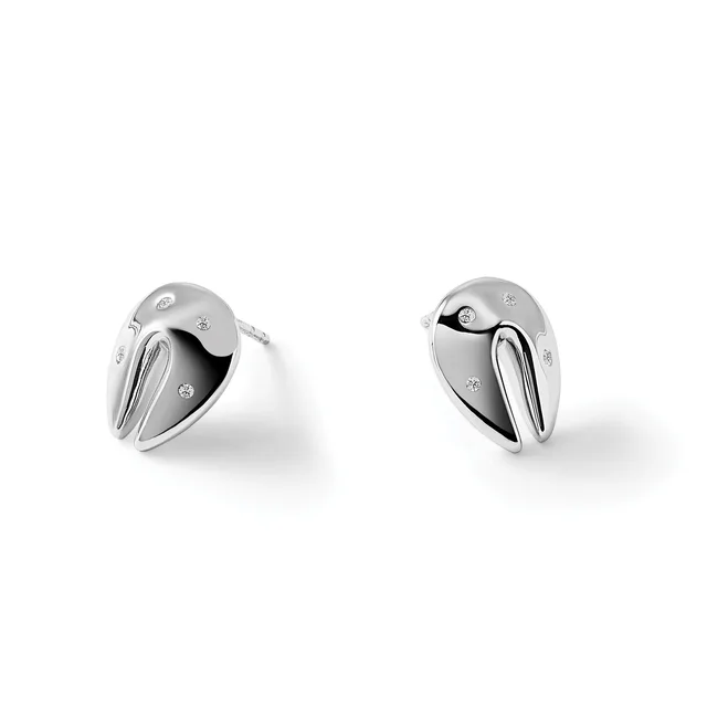 A pair of polished silver stud earrings with black enamel details and small diamond accents, shown from two angles against a white background.
