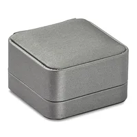 A square silver-gray metal box with rounded corners and a hinged lid, shown closed against a white background.