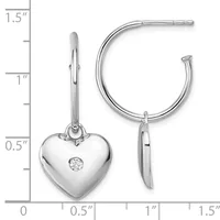 Silver hoop earrings with detachable heart charms featuring a center diamond, shown next to a measurement scale.