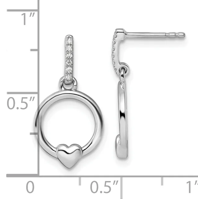 A pair of silver dangle earrings with cubic zirconia-studded posts, each featuring a circular ring with a small heart charm, shown with a measurement scale.