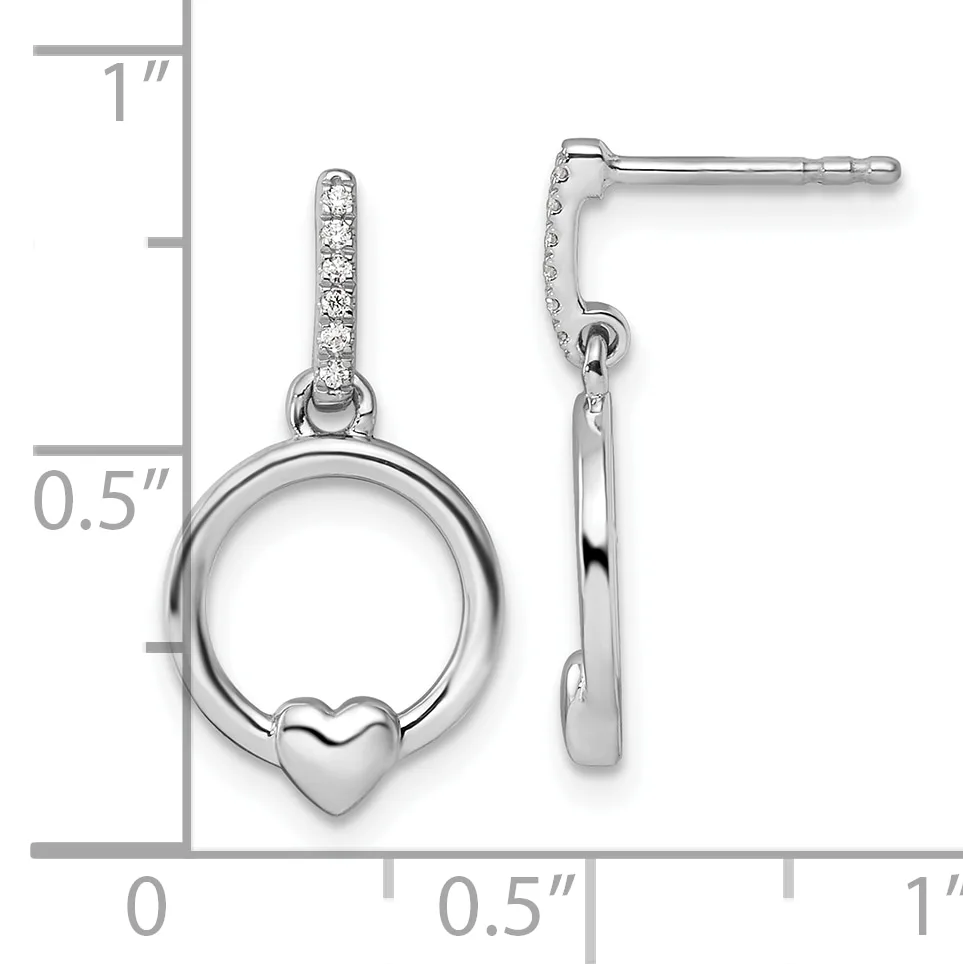 A pair of silver dangle earrings with cubic zirconia-studded posts, each featuring a circular ring with a small heart charm, shown with a measurement scale.