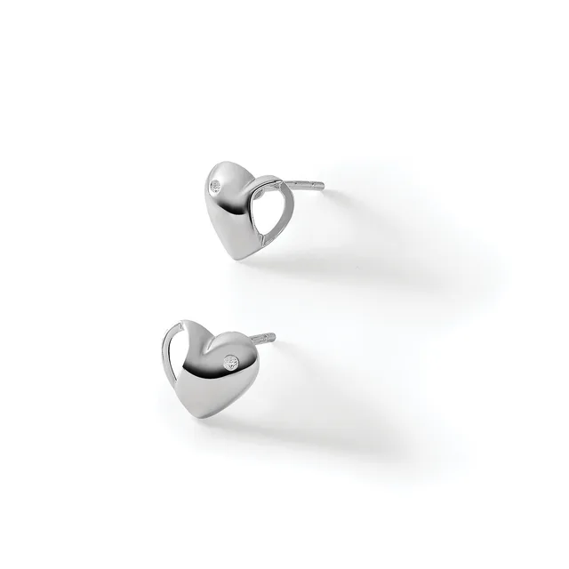 A pair of polished silver heart-shaped stud earrings with small diamond accents, displayed against a white background.