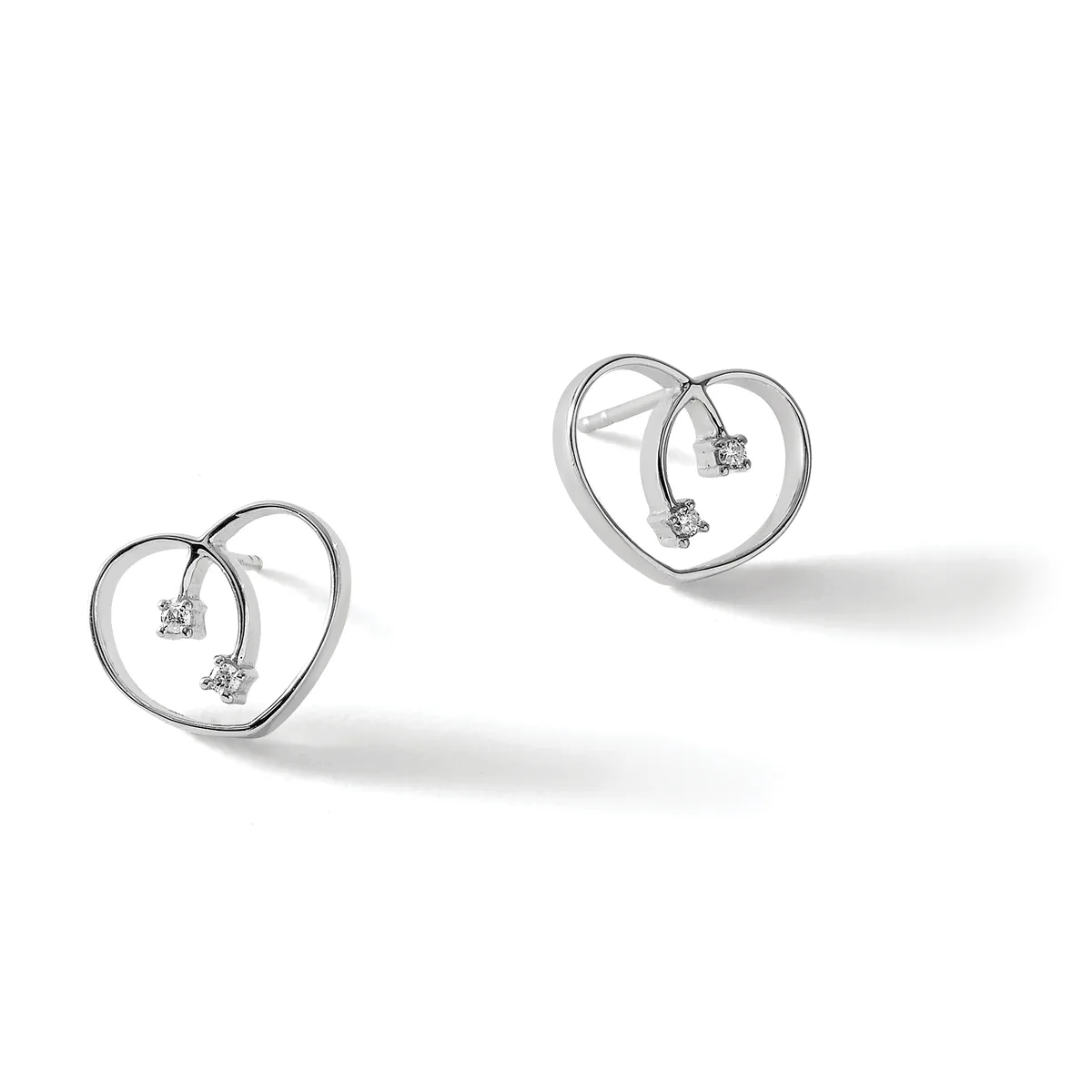 Two silver heart-shaped earrings with small diamond studs hanging inside each heart outline, shown at different sizes against a white background.
