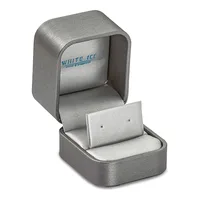 An open gray velvet jewelry box with a white satin interior and a removable earring display stand, shown from an angled view.
