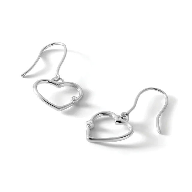 A pair of silver heart-shaped dangle earrings with curved fish hook ear wires, displayed against a white background.