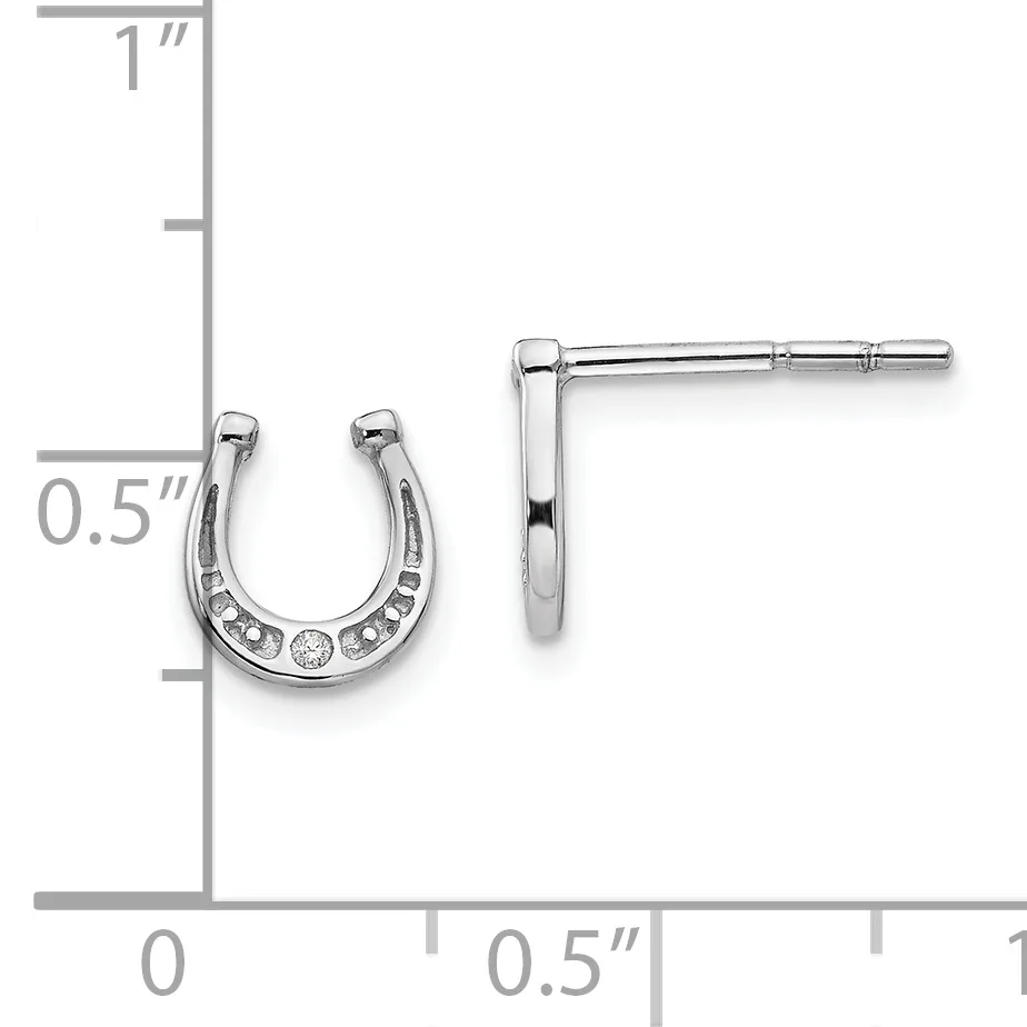 A pair of silver horseshoe-shaped stud earrings with cubic zirconia accents, displayed on a measurement scale showing approximately 0.5 inches in height.