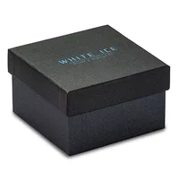 A black textured gift box with a hinged lid sits at an angle against a white background.