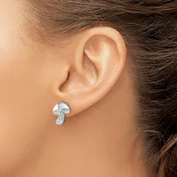 A silver mushroom-shaped stud earring with a small stamped hallmark on the stem, worn on a person's earlobe.