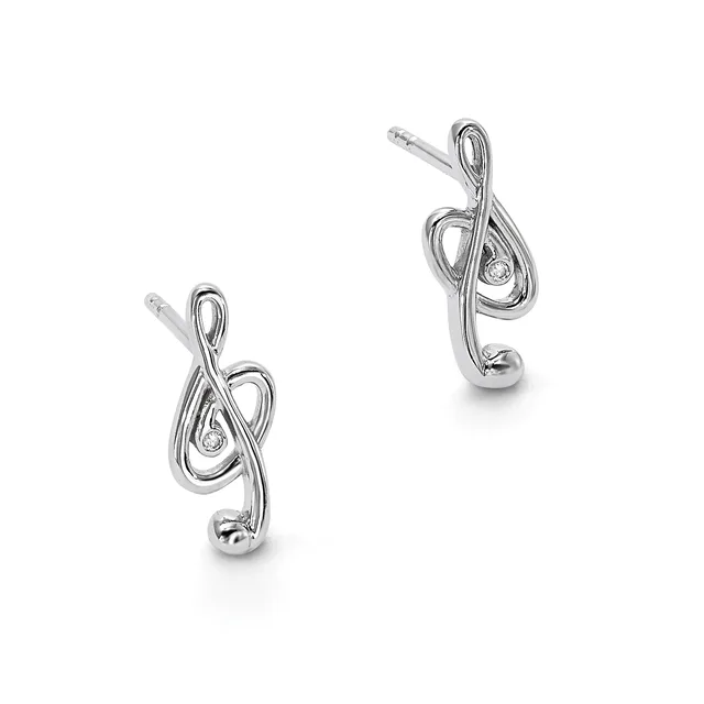A pair of silver treble clef earrings with small diamond accents and post backs, displayed against a white background.