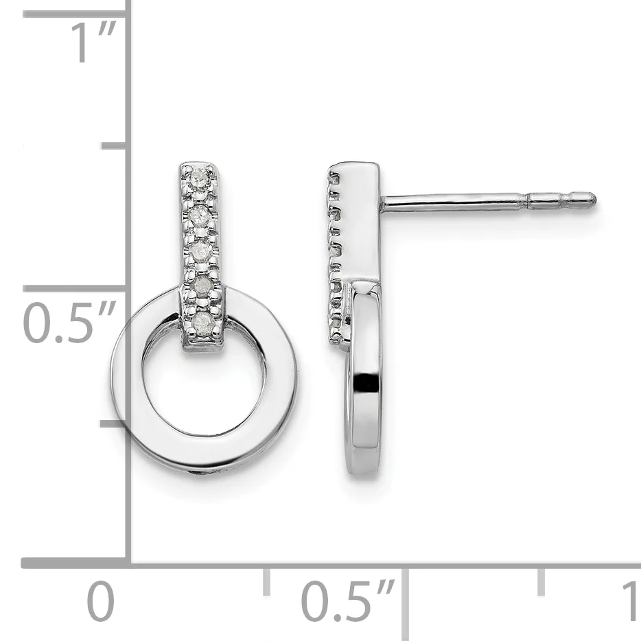 Pair of silver stud earrings featuring diamond-paved rectangular tops connected to polished circular drops, displayed against a measurement scale.