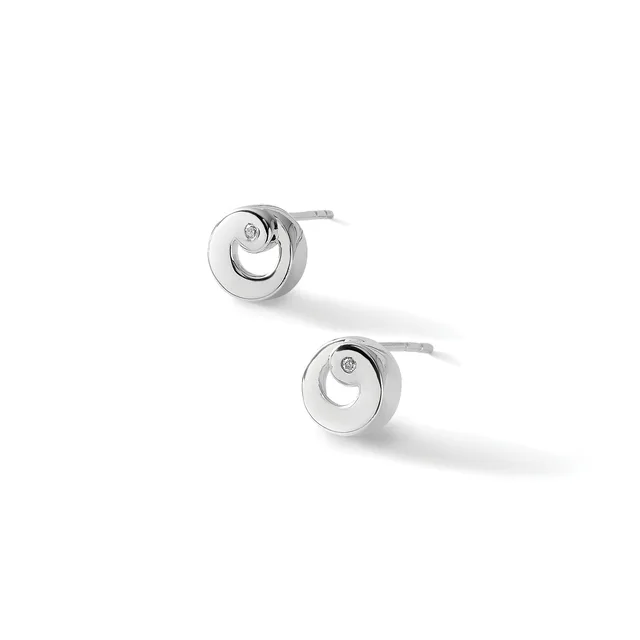 A pair of silver stud earrings with circular faces featuring concentric rings and small diamond accents, displayed against a white background.