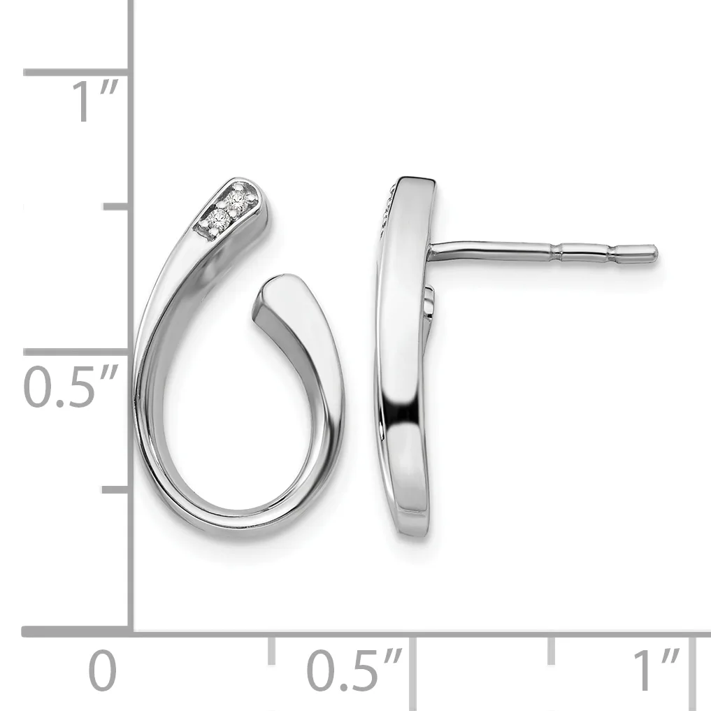 A pair of silver curved hoop earrings with diamond accents shown next to a measurement scale indicating approximately one inch in length.