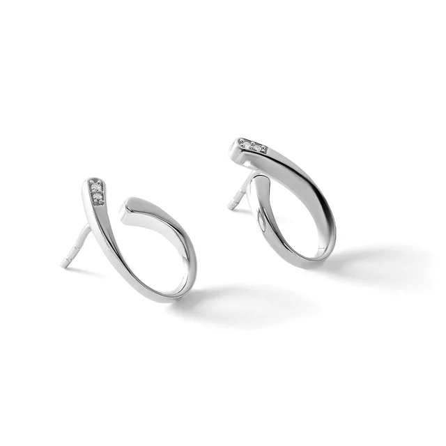 A pair of silver hoop earrings with small diamond accents on the posts, displayed on white stands against a light background.