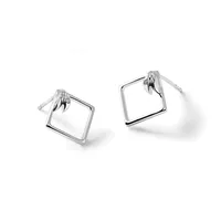 A pair of silver square stud earrings with open centers and small posts, shown from a three-quarter view against a white background.