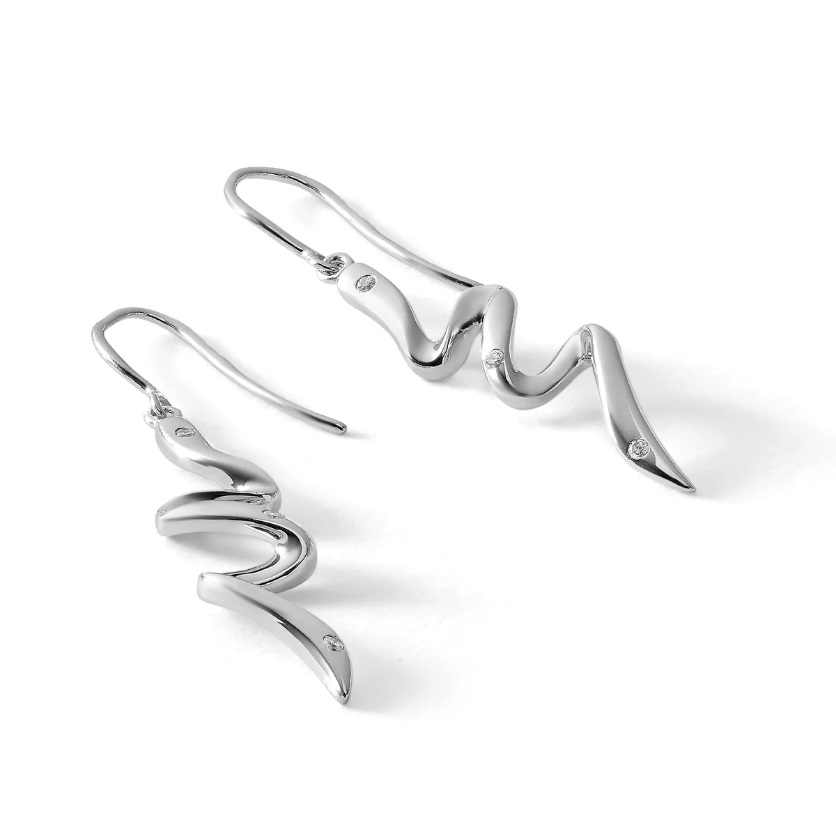 A pair of silver drop earrings with curved, wavy designs and small diamond accents, displayed against a white background.