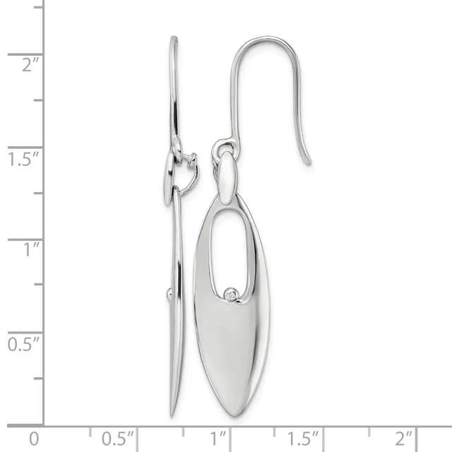 A pair of silver oval dangle earrings with elongated hook wires, displayed against a ruler showing measurements up to 2.5 inches.