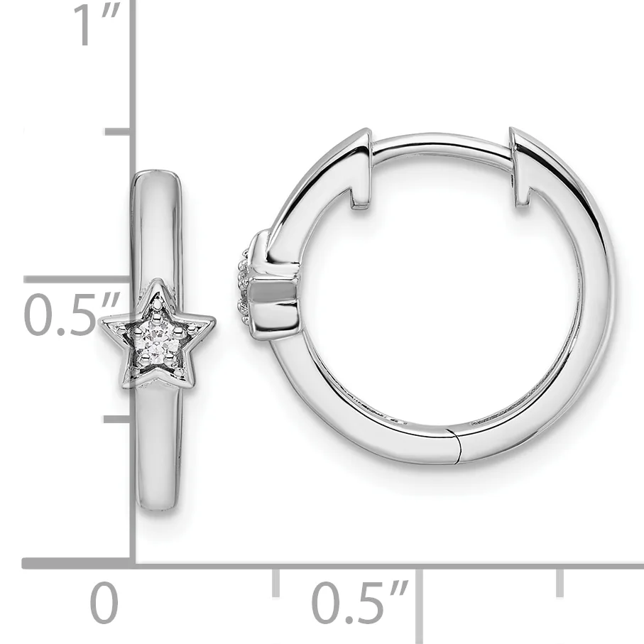 Silver huggie hoop earrings with star charms set with small diamonds, shown with measurement scale indicating approximately one inch in length.