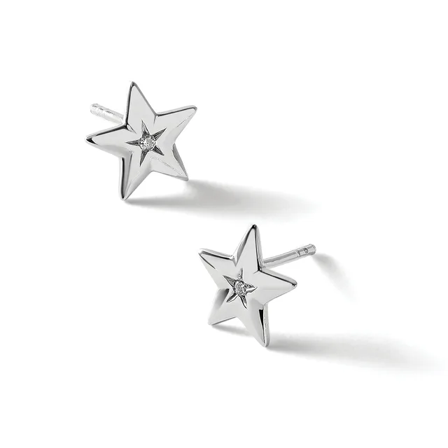 A pair of silver star-shaped stud earrings with small diamonds at the centers, shown from different angles against a white background.