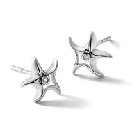A pair of silver stud earrings with four-pointed star designs, each featuring a small diamond at the center, shown from two angles against a white background.