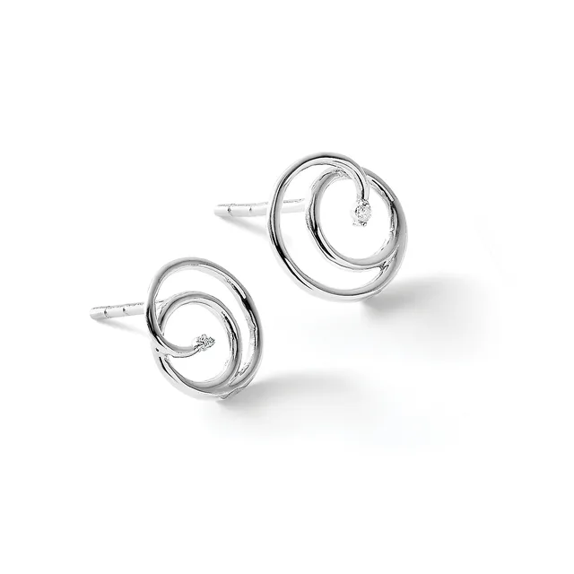 A pair of silver stud earrings featuring concentric circular designs with small diamonds set within spiral elements.