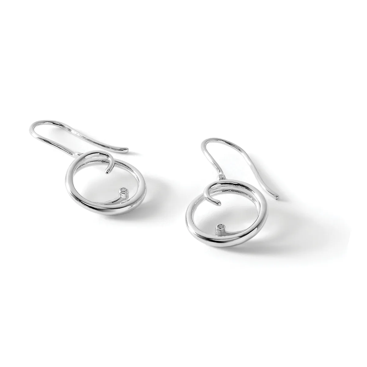 A pair of silver drop earrings with circular loops and small diamond studs, shown on a white background with soft shadows.