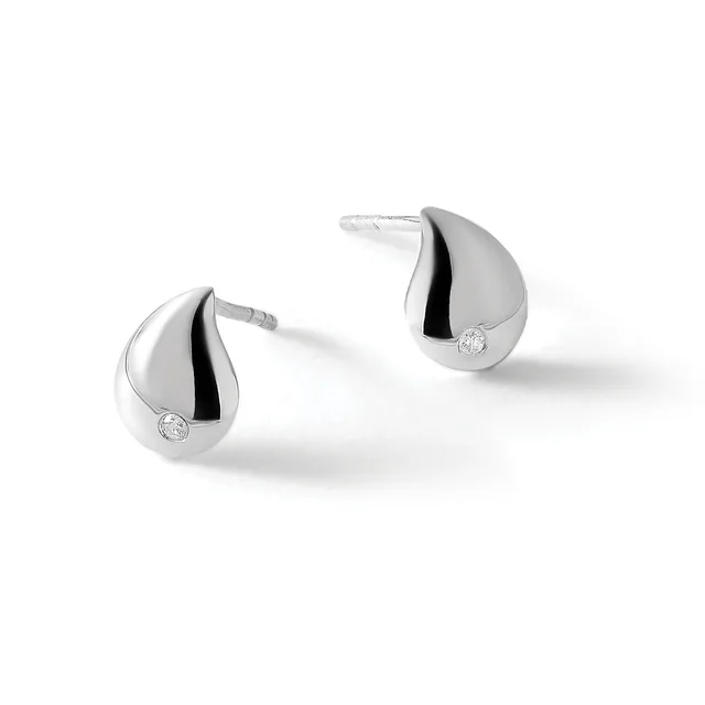 A pair of teardrop-shaped silver stud earrings with black enamel accents and small round diamond or crystal stones, shown from a front angle.