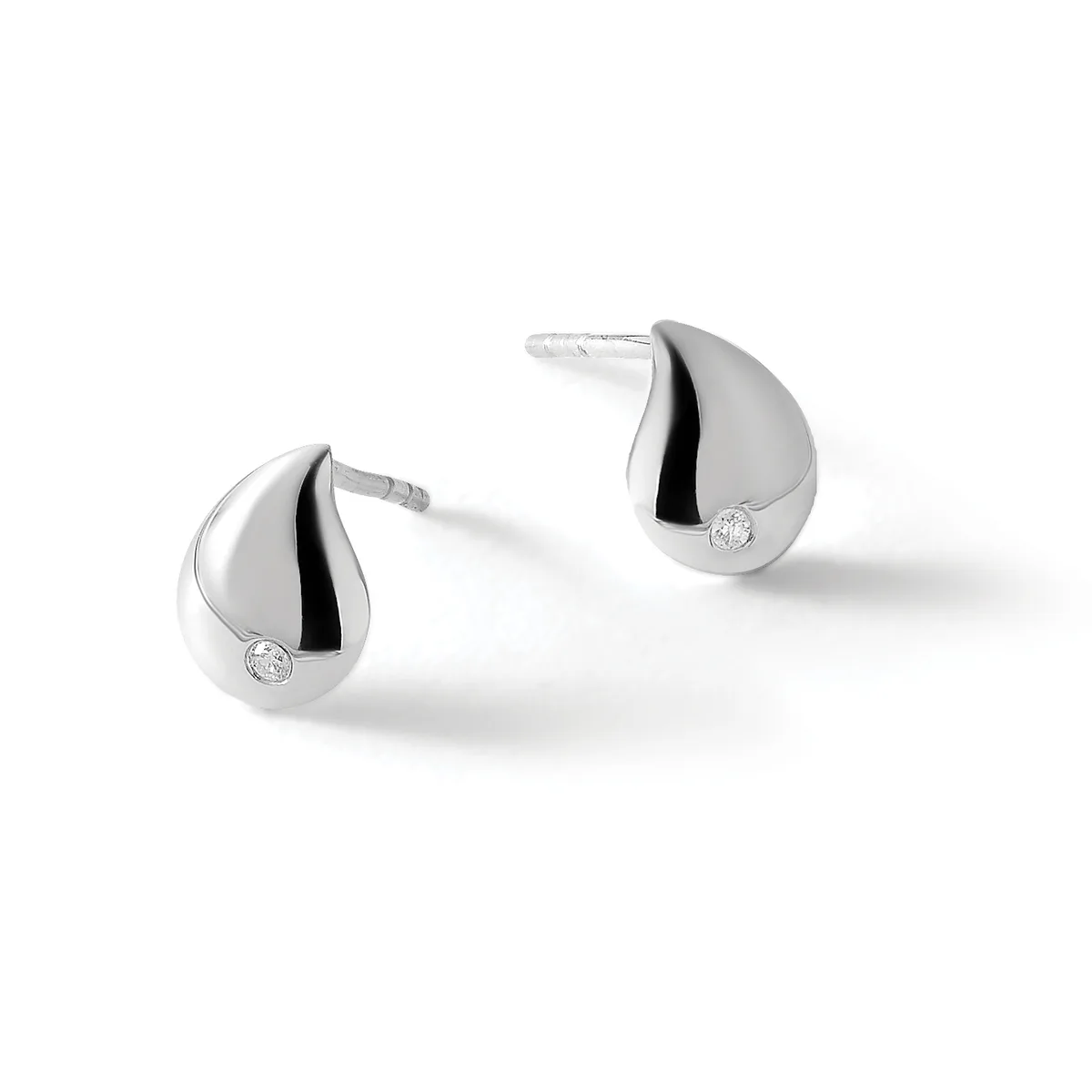 A pair of teardrop-shaped silver stud earrings with black enamel accents and small round diamond or crystal stones, shown from a front angle.