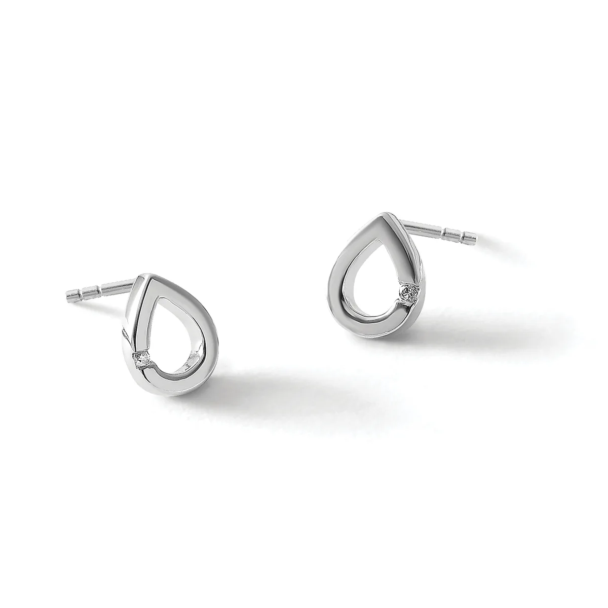 A pair of silver teardrop-shaped stud earrings with small diamonds, displayed against a white background.